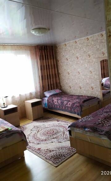 Фото номера Двухместный номер с 2 отдельными кроватями и общей ванной комнатой Гостевой дом Гостевой дом У Павла г. Тамга 4